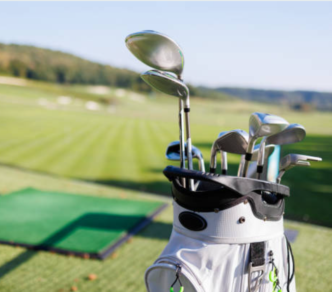 Golf bag care wiping down fabric to remove dirt